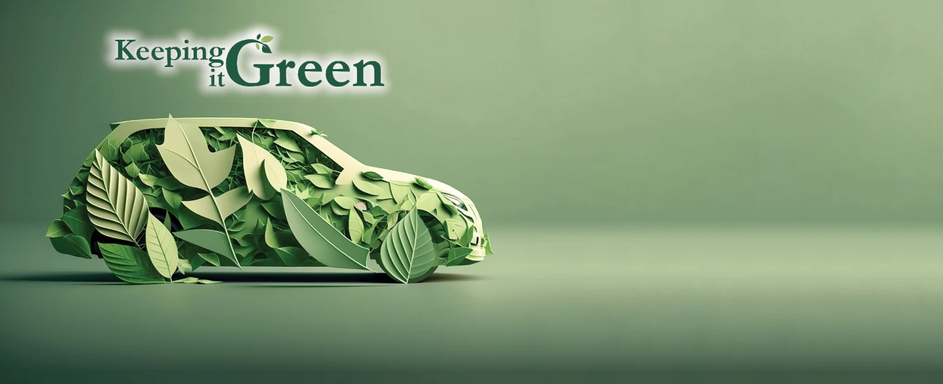 Picture of a car made out of tree leaves and the words 'keeping it green'